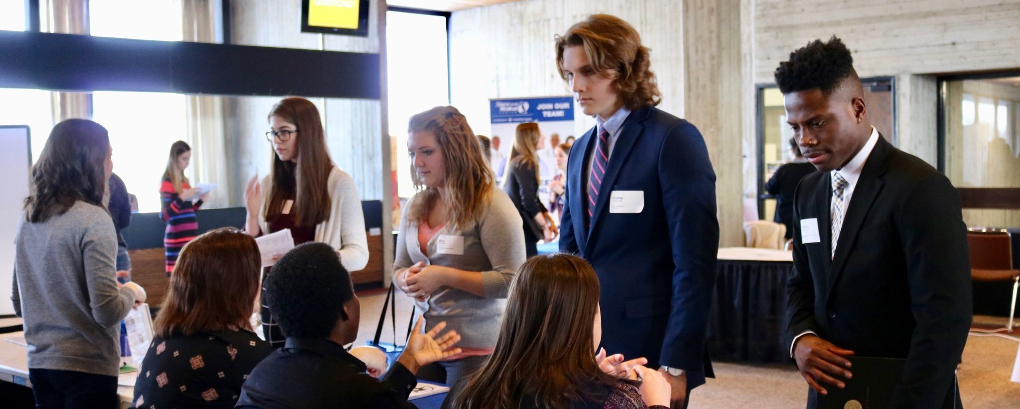 Group of students attend a job fair